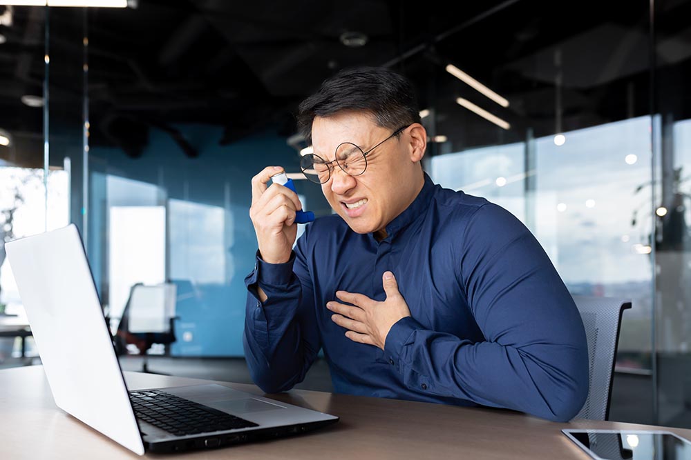 asthma attack at work asian businessman having di 2022 12 03 01 50 02 utc